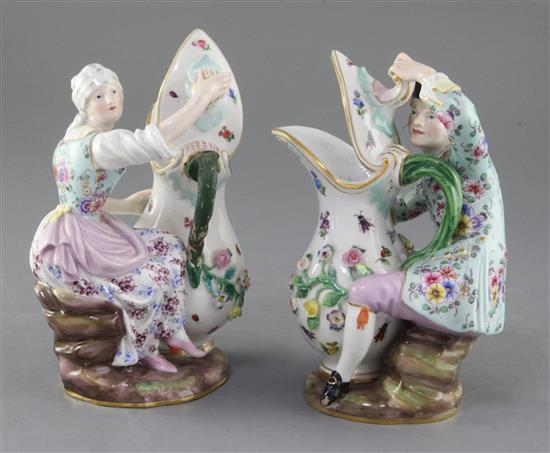 A pair of Meissen figural ewers, 19th century, height 18.5cm and 19.5cm